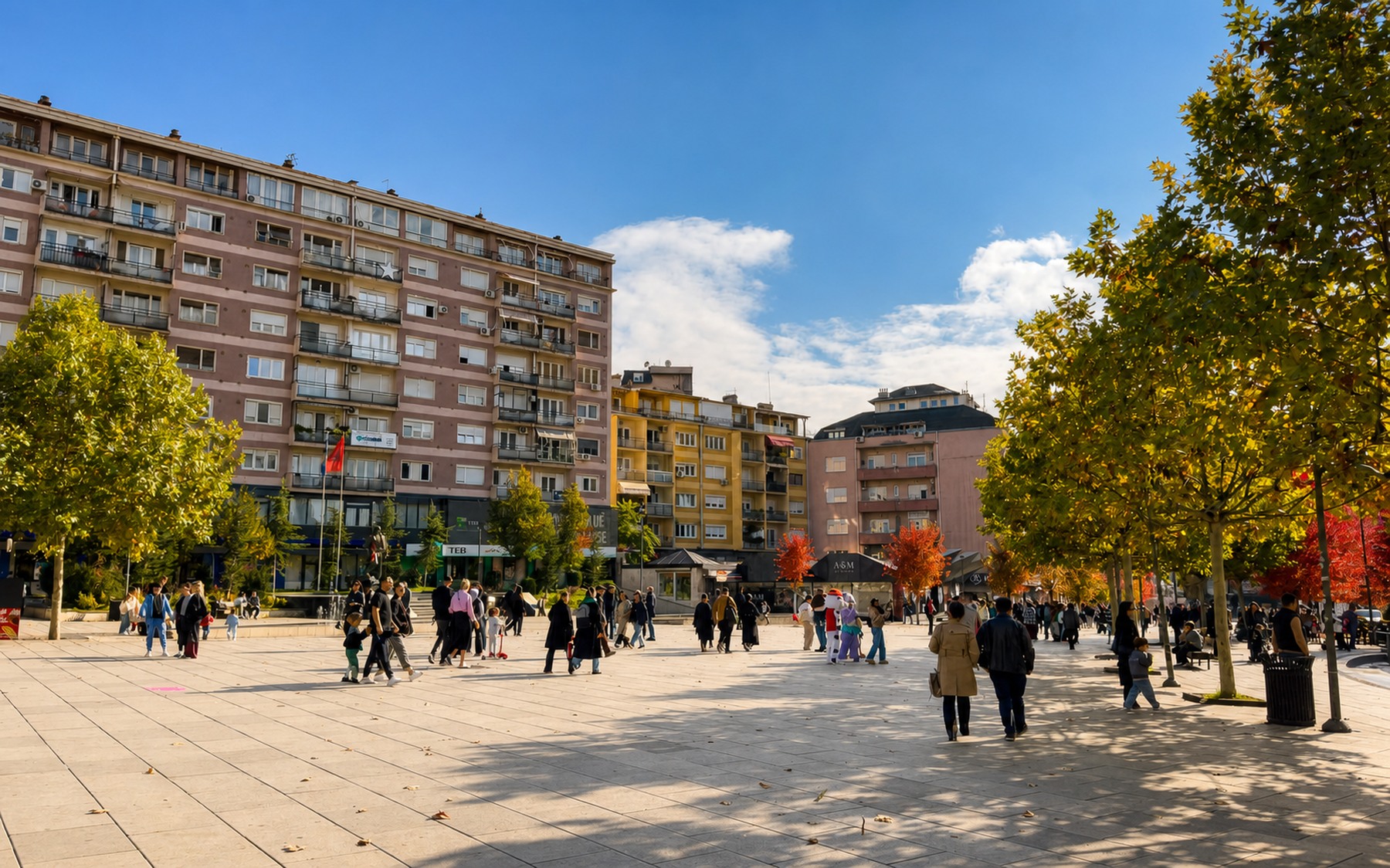 People walking through Mother Teresa Square in central Prishtina